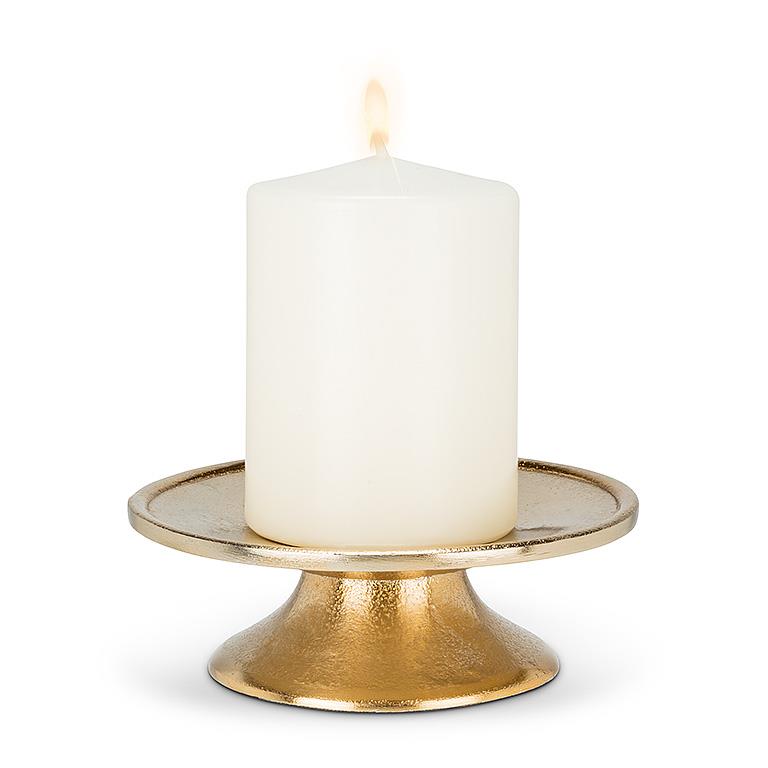 Low Pillar Plate in gold with a white pillar candle burning.