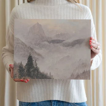 Artist holding the Celestial Mountain Artist Board which features soft pastels and a vintage  feel. 