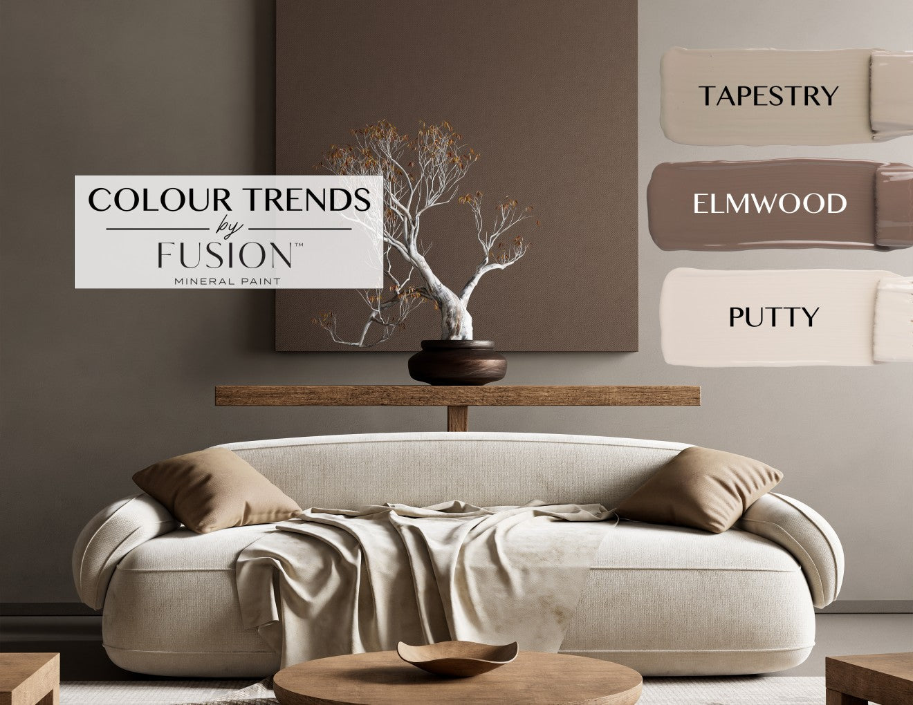 Living room styled with neutral tones featuring Fusion Mineral Paint's 2025 color trends: 'Tapestry,' a warm beige, 'Elmwood,' a rich taupe, and 'Putty,' a light cream. A modern cream sofa with beige cushions sits below a wooden console table with a sculptural tree centerpiece, showcasing the earthy and sophisticated palette.