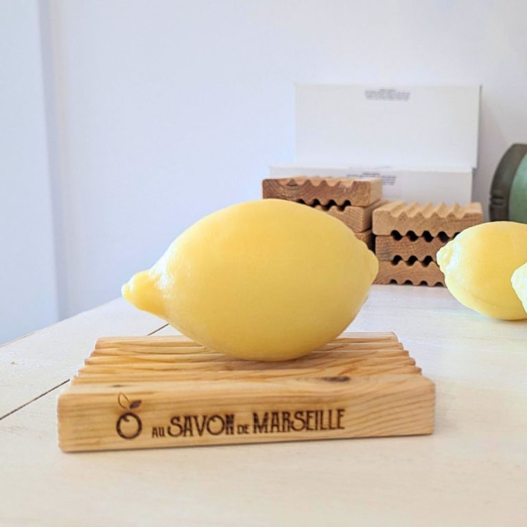 Marseille Lemon Shape Soap Bar on a wood soap deck in the kitchen. 