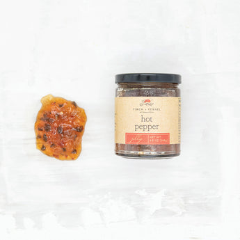 Clear jam of hot pepper jelly with a dollop next to it. 