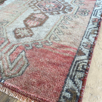 Repurposed vintage Turkish rug with shades of pink and brown. 