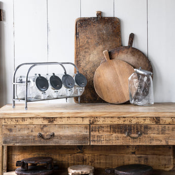 Styled Chapati boards on a rustic kitchen counter. 