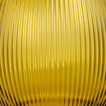 Close up view of the ribbed amber glass pitcher. 