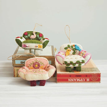 Handmade Wool Felt Chair Ornament with Applique & Hand-Embroidery resting on vintage boxes. 