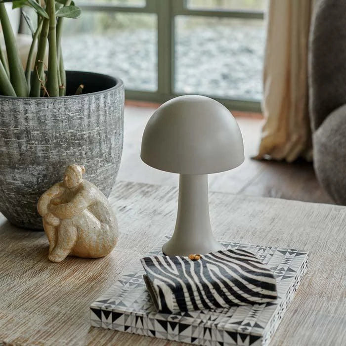 Jules LED Lamp styled with a zebra print notebook.