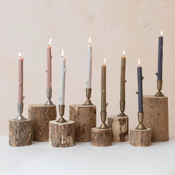 Unscented Twig Shaped Taper Candles displayed in antique brass candle holders. 