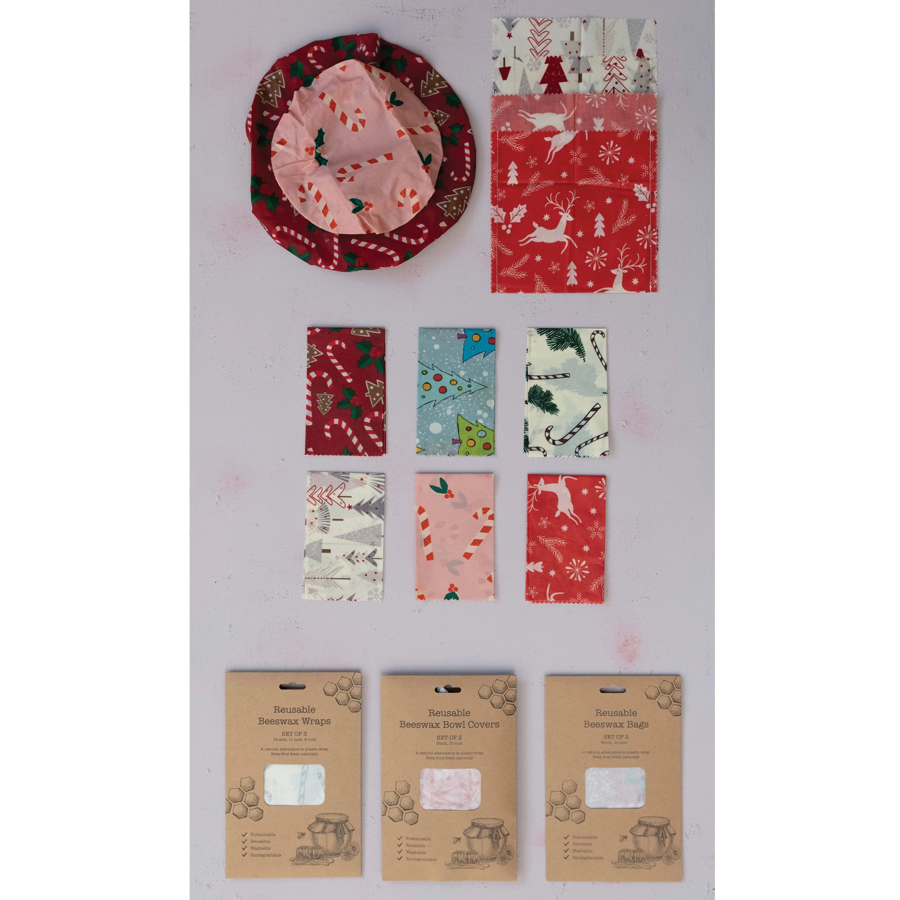 Environmentally friendly reusable beeswax food wraps with various holiday designs.