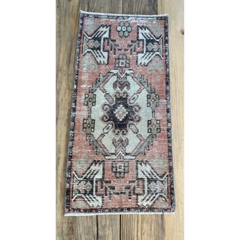 Turkish area rug in earthy Pink with brown, beige and hints of blue gray.