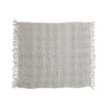 Woven Cotton Blend Cable Knit Throw with Fringe in a natural color.